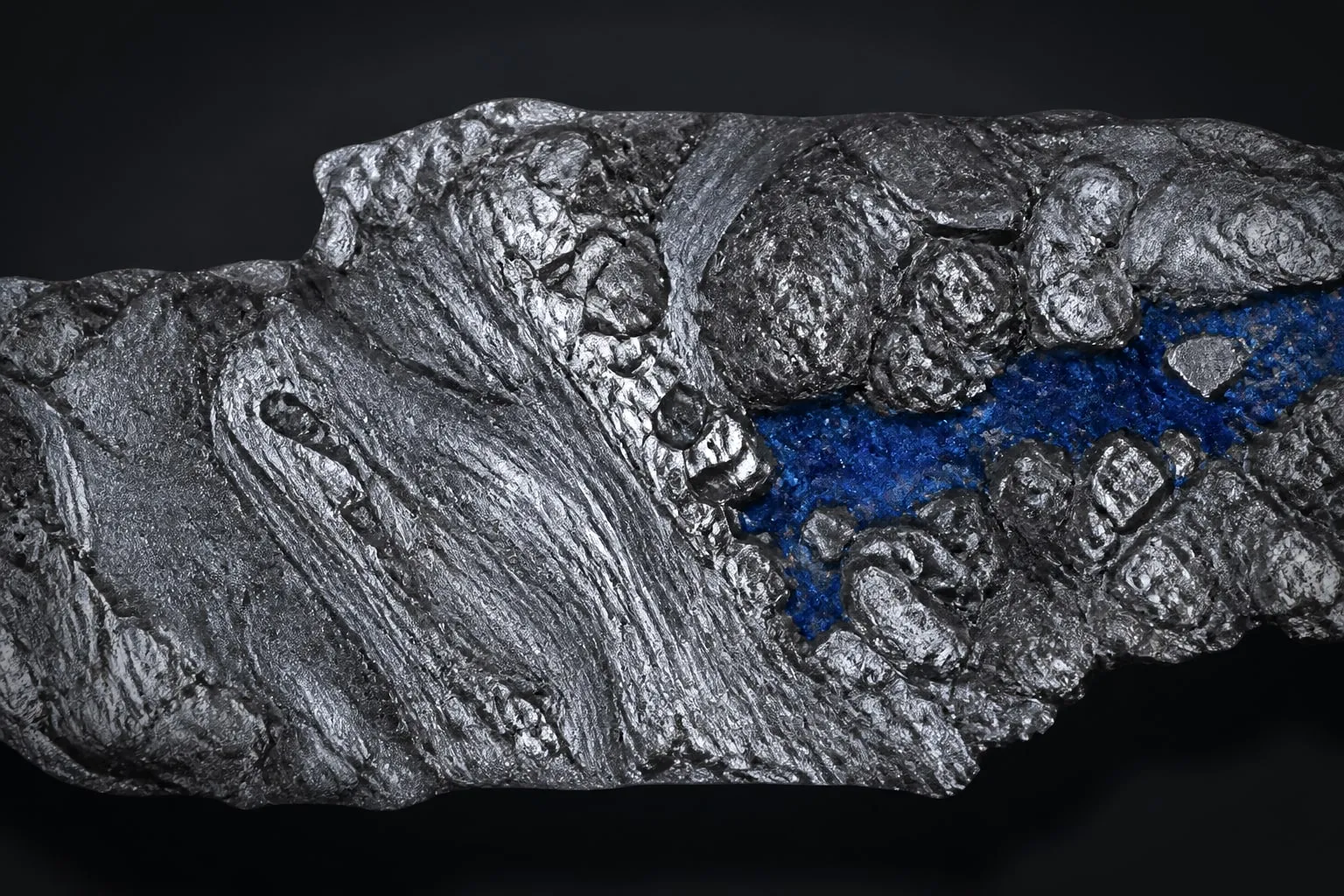 Editorial illustration: silver amalgam metal texture macro