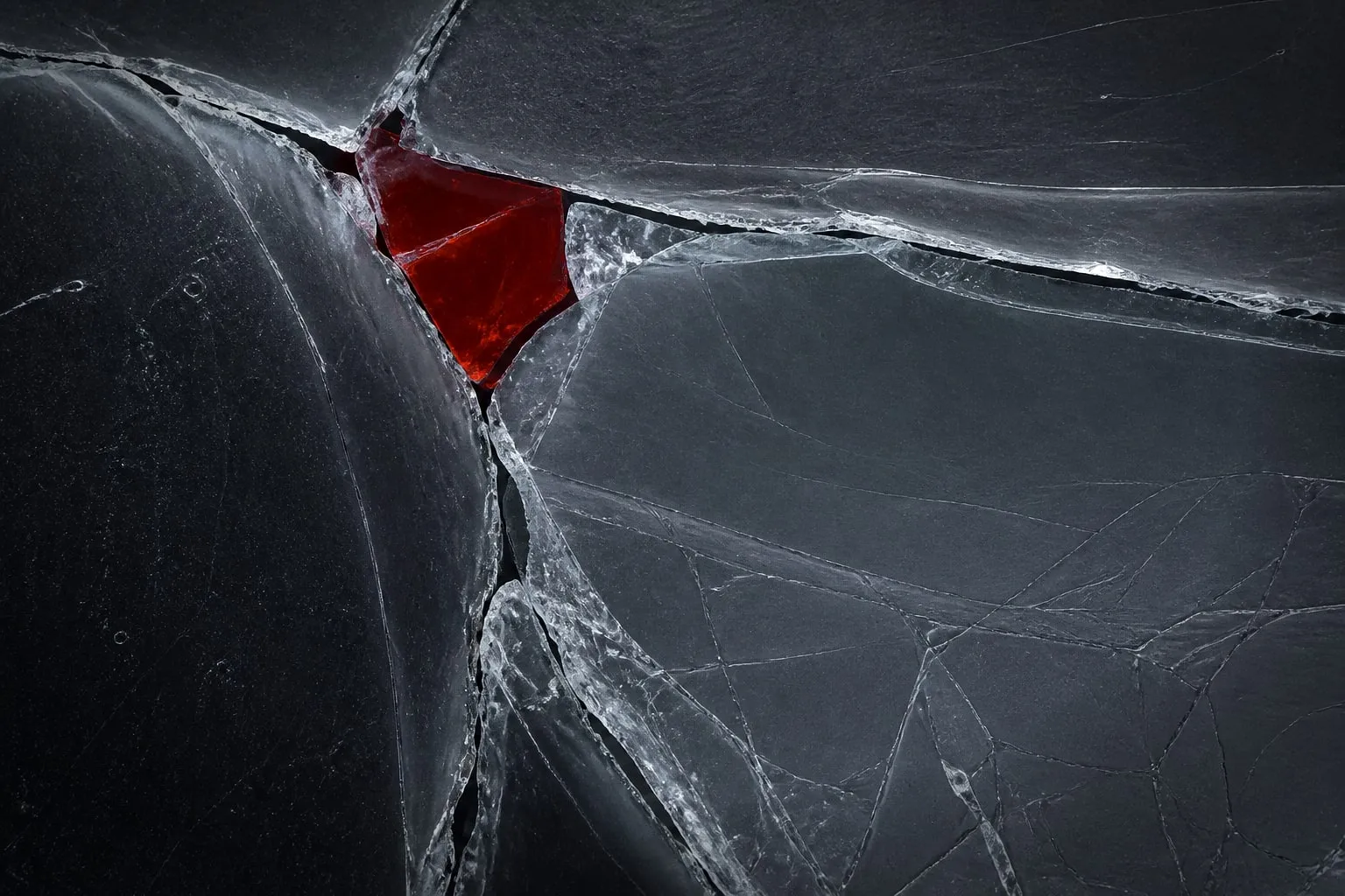 Editorial illustration: cracked glass surface macro close up