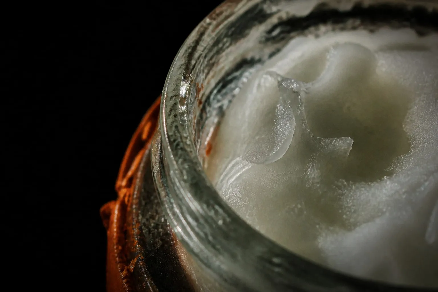 Editorial illustration: coconut oil jar macro close up