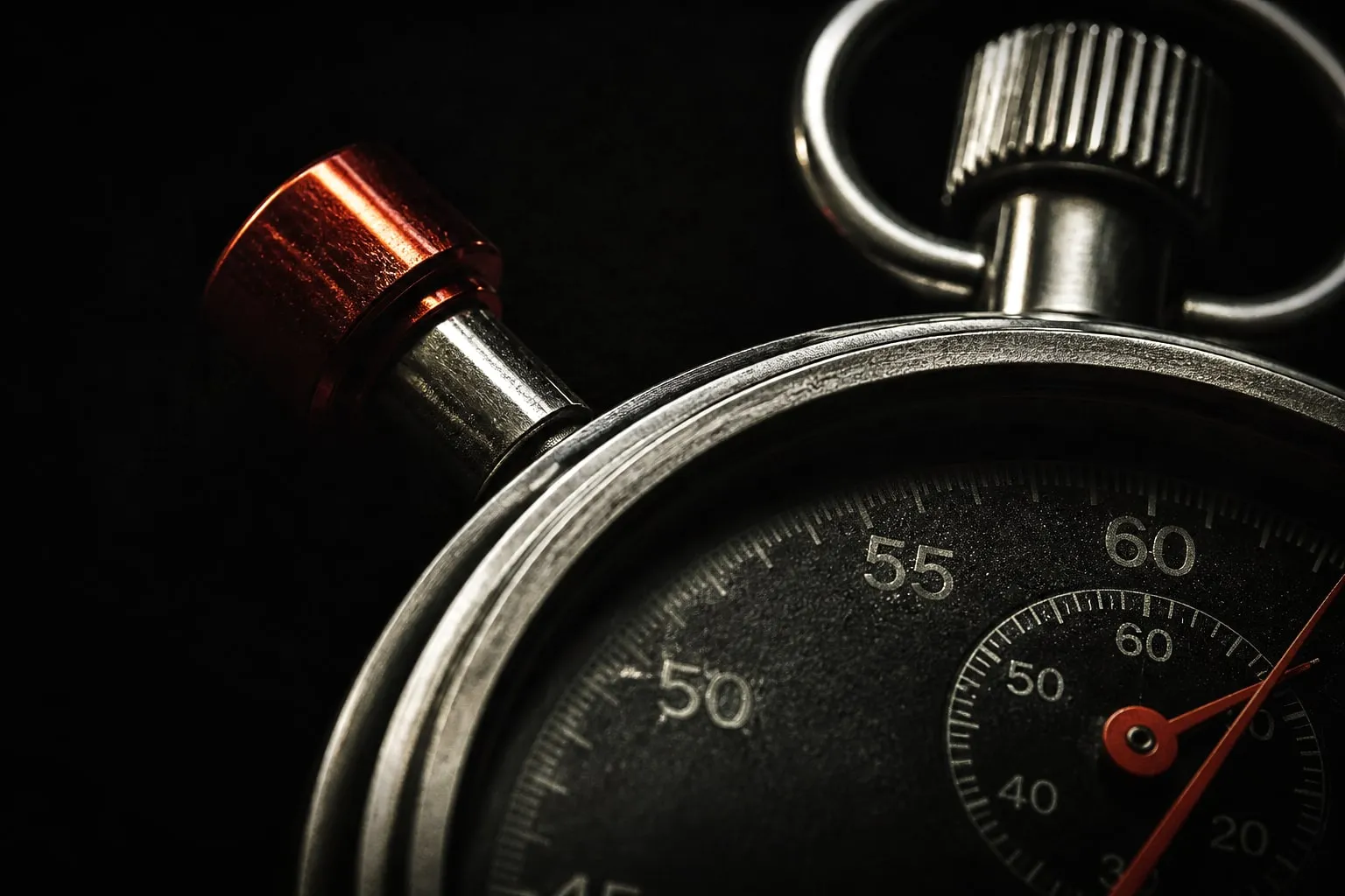 Editorial illustration: stopwatch macro dark background