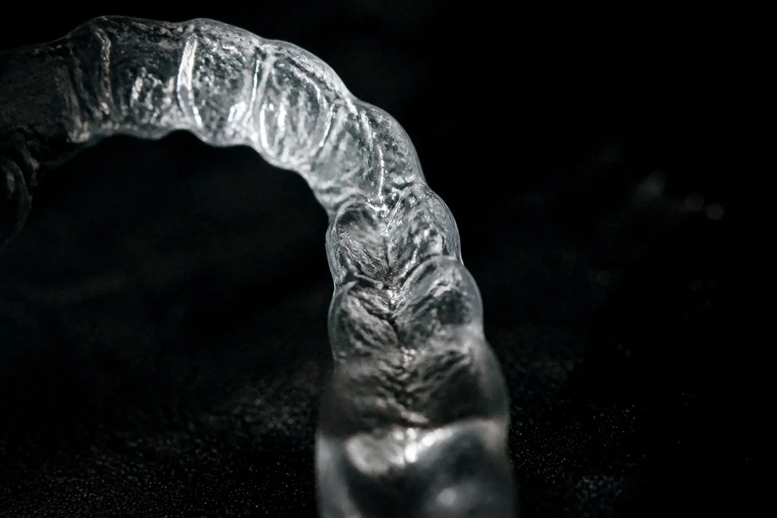 Editorial illustration: clear plastic aligner tray close up